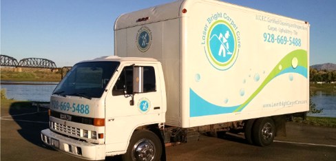 Laser Bright Carpet Care truck-mounted cleaning truck parked by the Colorado River